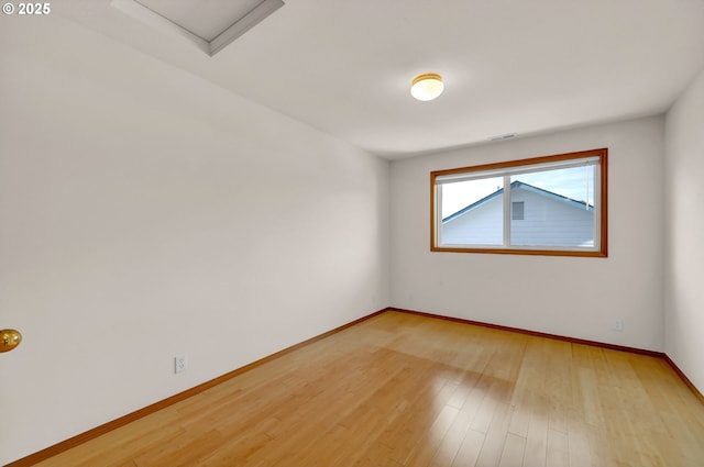 4095 Eddystone Pl, Eugene, OR 97404 - empty room featuring light wood-style flooring, baseboards, and attic access