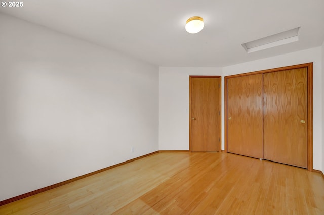 4095 Eddystone Pl, Eugene, OR 97404 - unfurnished bedroom with attic access, light wood-style flooring, and baseboards