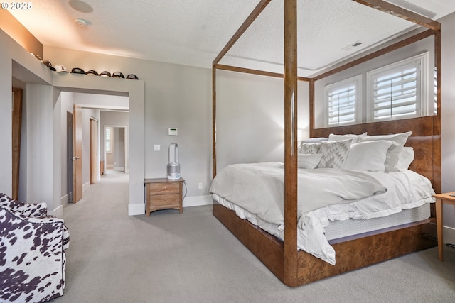 10155 SW Morrison St, Portland, OR 97225 - carpeted bedroom with a textured ceiling and multiple windows
