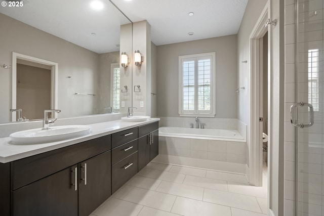 10155 SW Morrison St, Portland, OR 97225 - bathroom featuring double vanity, a garden tub, a shower stall, and tile patterned floors