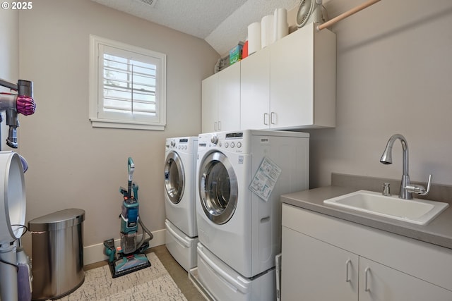 10155 SW Morrison St, Portland, OR 97225 - laundry area with washing machine and dryer, cabinet space, and a textured ceiling