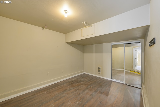 basement featuring dark hardwood / wood-style floors