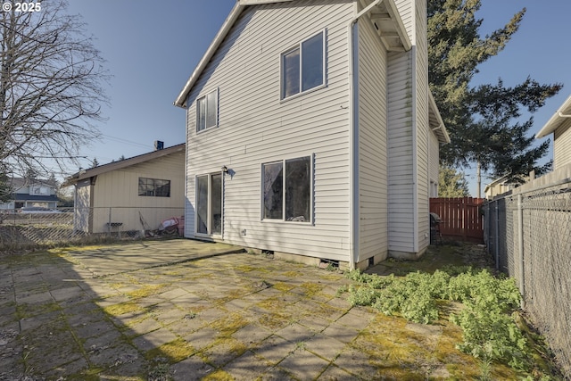 back of house with a patio area