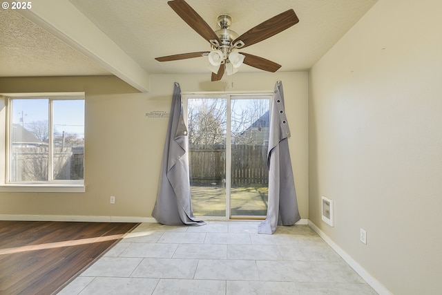 unfurnished room featuring ceiling fan, a textured ceiling, and light hardwood / wood-style floors