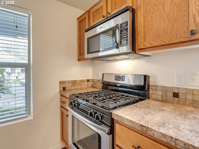 kitchen with stainless steel appliances and light countertops