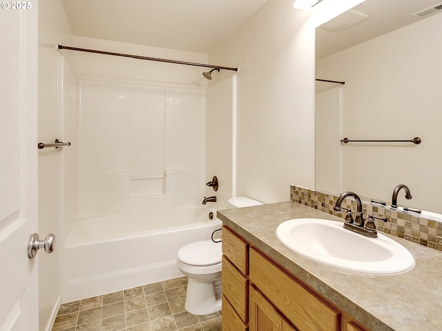 bathroom featuring vanity, visible vents, bathing tub / shower combination, toilet, and backsplash