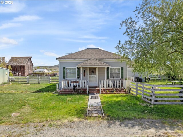 710 School St, Haines, OR 97833 - view of front facade featuring covered porch and roof with shingles