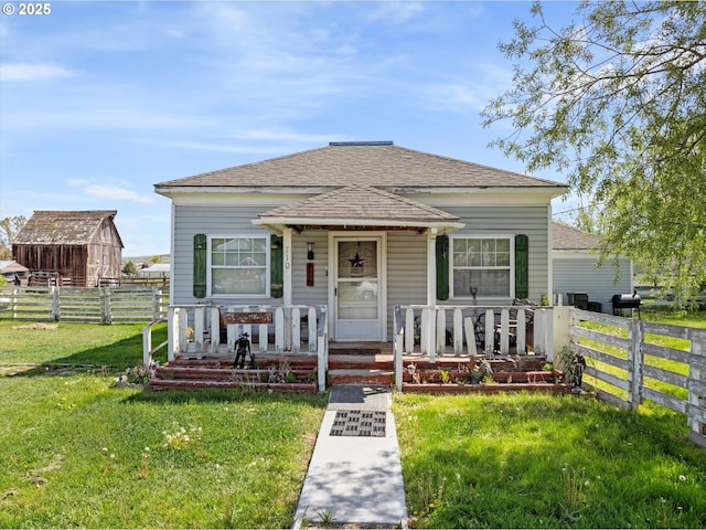 710 School St, Haines, OR 97833 - view of front of house featuring covered porch and roof with shingles