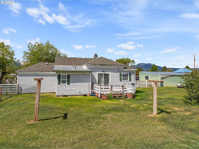710 School St, Haines, OR 97833 - back of property with a deck with mountain view, crawl space, and a shingled roof