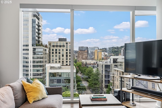 1075 NW Northrup St Unit 814, Portland, OR 97209 - interior space featuring floor to ceiling windows, a healthy amount of sunlight, and wood finished floors