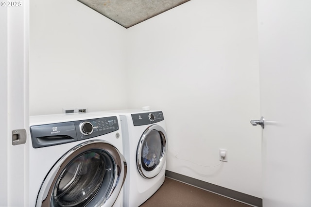 1075 NW Northrup St Unit 814, Portland, OR 97209 - laundry room with laundry area and washing machine and dryer