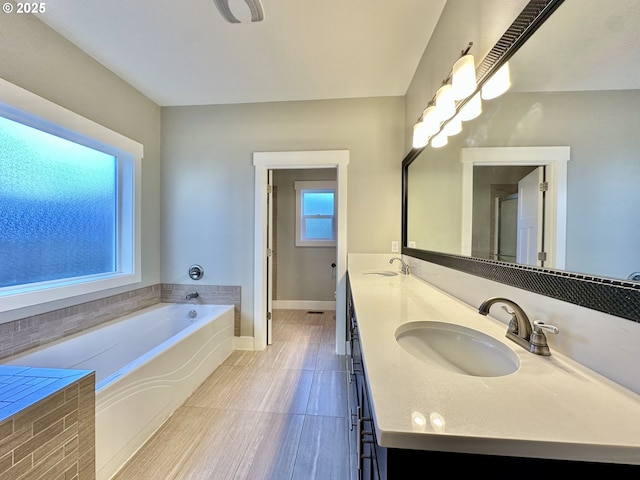 bathroom featuring vanity and a bathtub