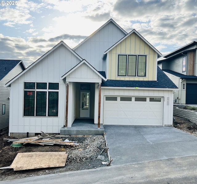 modern farmhouse style home with roof with shingles, board and batten siding, a garage, and driveway