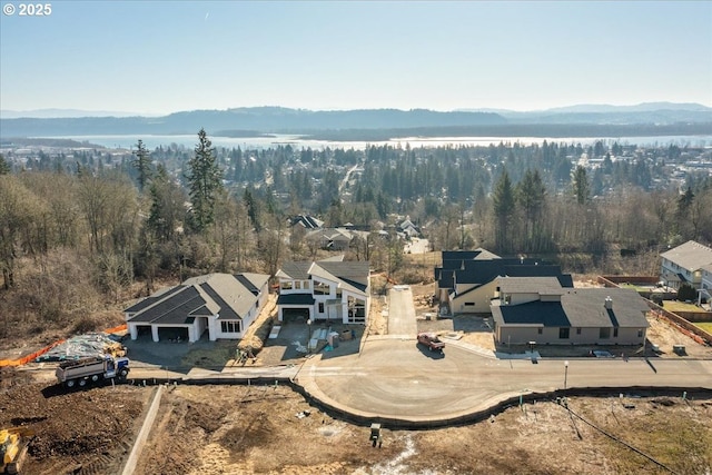 bird's eye view featuring a residential view, a forest view, and a mountain view