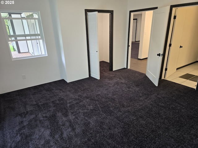 unfurnished bedroom with carpet flooring
