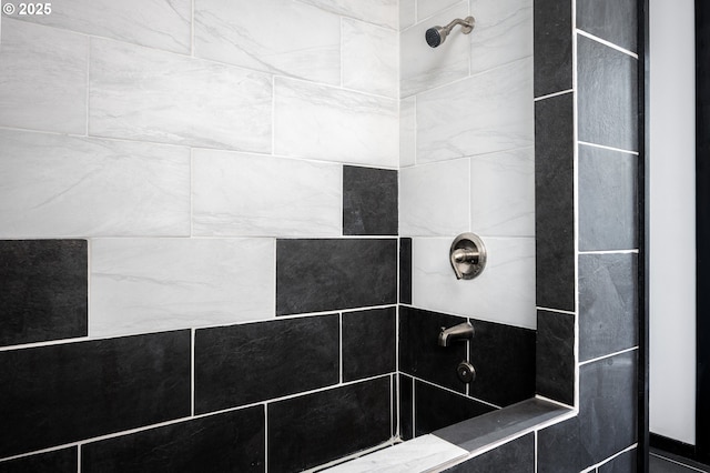 bathroom with a tile shower
