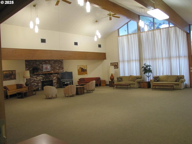 living room featuring a fireplace, ceiling fan with notable chandelier, high vaulted ceiling, beamed ceiling, and carpet floors