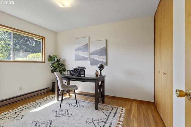 12395 SE Main St, Portland, OR 97233 - home office featuring wood finished floors and a baseboard radiator