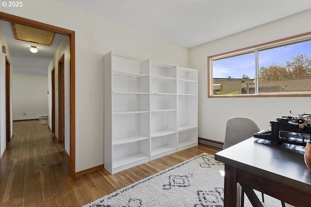 12395 SE Main St, Portland, OR 97233 - office with baseboard heating and hardwood / wood-style floors
