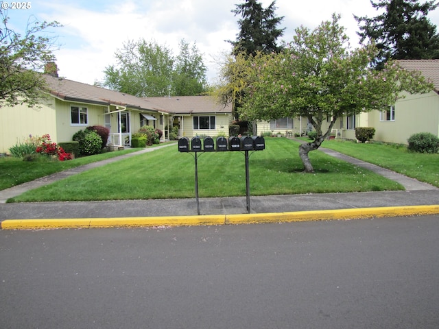 view of front of property with a front lawn