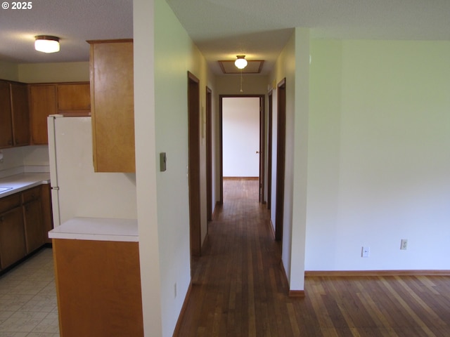 corridor with a textured ceiling