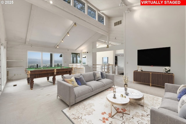 carpeted living area featuring track lighting, billiards table, beam ceiling, and high vaulted ceiling