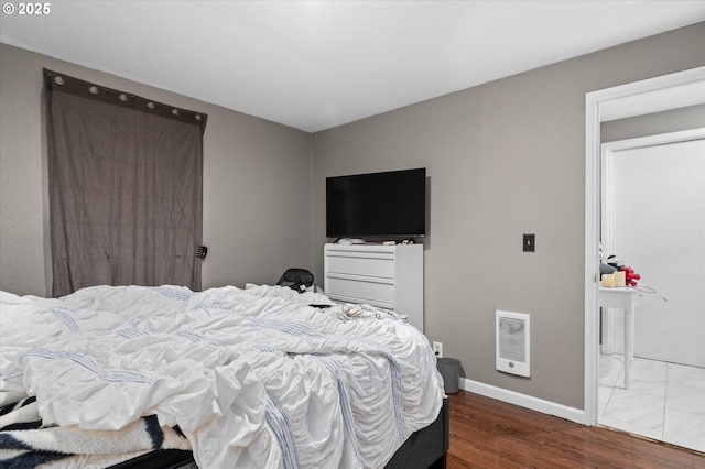 bedroom with wood-type flooring