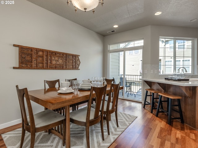11656 SW Auklet Loop, Beaverton, OR 97007 - dining space with wood finished floors, plenty of natural light, recessed lighting, and a textured ceiling