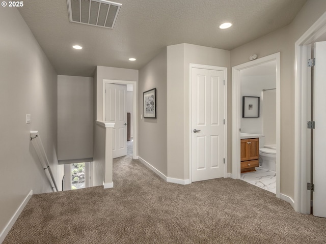 11656 SW Auklet Loop, Beaverton, OR 97007 - hall with an upstairs landing, carpet flooring, recessed lighting, and a textured ceiling