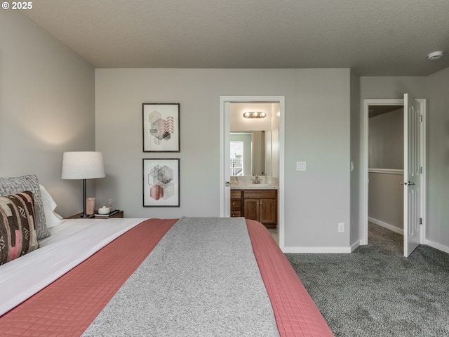 11656 SW Auklet Loop, Beaverton, OR 97007 - carpeted bedroom featuring ensuite bath and a textured ceiling