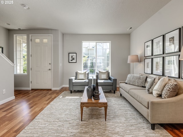 11656 SW Auklet Loop, Beaverton, OR 97007 - living area featuring wood finished floors and a textured ceiling