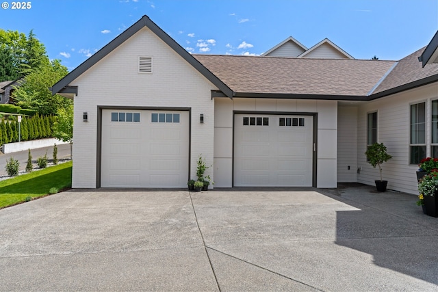5100 S St, Washougal, WA 98671 - view of front facade with concrete driveway, brick siding, an attached garage, and roof with shingles