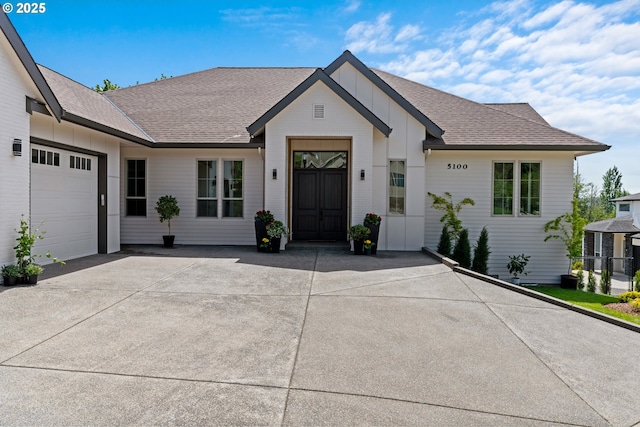 5100 S St, Washougal, WA 98671 - modern farmhouse style home with a garage, board and batten siding, driveway, and roof with shingles