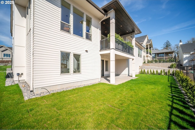 5100 S St, Washougal, WA 98671 - rear view of house featuring a lawn, fence, a balcony, and a patio area