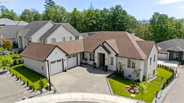 5100 S St, Washougal, WA 98671 - view of front facade featuring an attached garage, a shingled roof, a front lawn, and fence