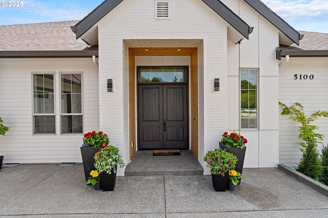 5100 S St, Washougal, WA 98671 - view of exterior entry with brick siding and roof with shingles