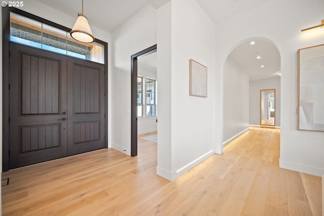 5100 S St, Washougal, WA 98671 - foyer entrance with arched walkways, baseboards, recessed lighting, and light wood-style floors