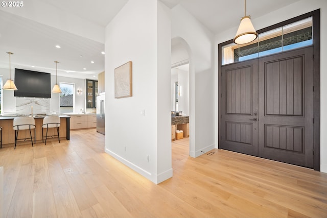 5100 S St, Washougal, WA 98671 - entrance foyer with light wood-type flooring, arched walkways, and a wealth of natural light