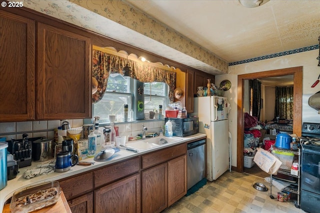 270 SW 173rd Ave, Beaverton, OR 97006 - kitchen with stainless steel dishwasher, black microwave, freestanding refrigerator, stove, and light countertops