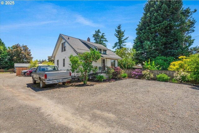 270 SW 173rd Ave, Beaverton, OR 97006 - view of front of home featuring a chimney and driveway