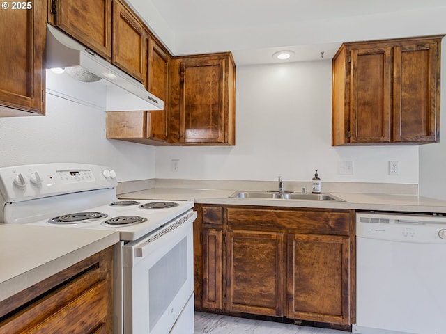 619 SE 121st Ave Unit 23, Vancouver, WA 98683 - kitchen featuring white appliances, under cabinet range hood, a sink, and light countertops