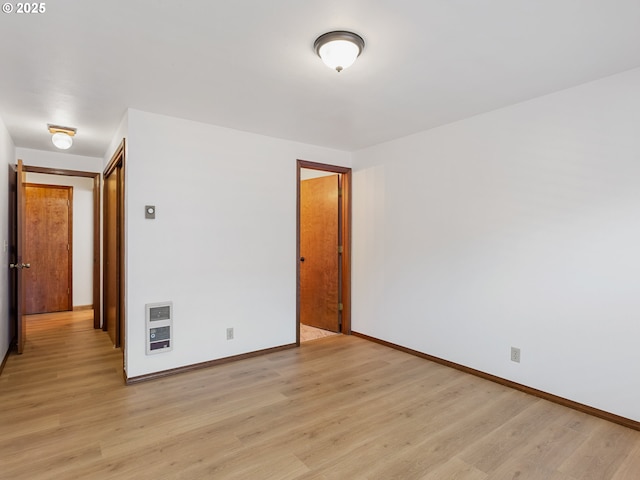 619 SE 121st Ave Unit 23, Vancouver, WA 98683 - spare room featuring light wood-style flooring, baseboards, and heating unit