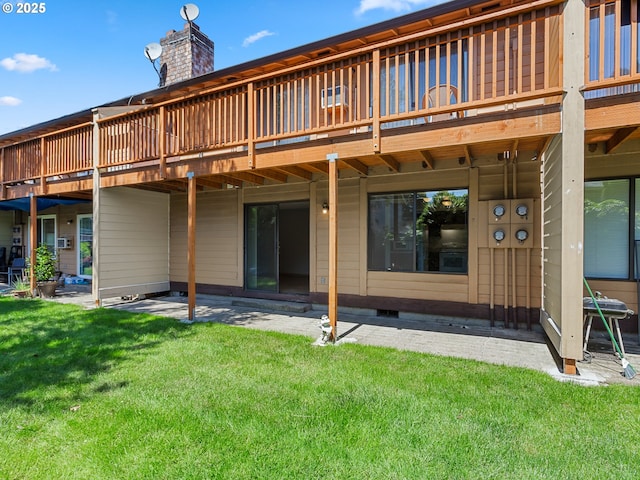 619 SE 121st Ave Unit 23, Vancouver, WA 98683 - back of house featuring a lawn, a wooden deck, a patio area, and a chimney