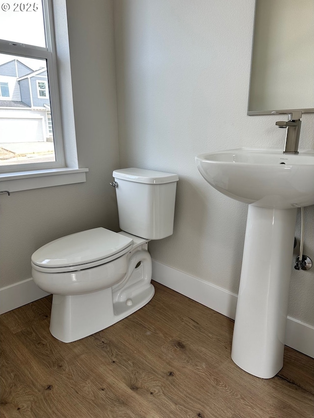13847 SW Sabrina Ave, Tigard, OR 97140 - bathroom featuring toilet, baseboards, and wood finished floors