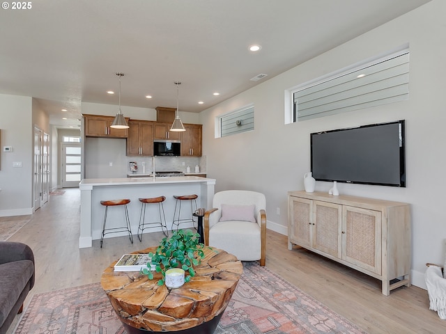 13847 SW Sabrina Ave, Tigard, OR 97140 - living area with light wood finished floors and recessed lighting