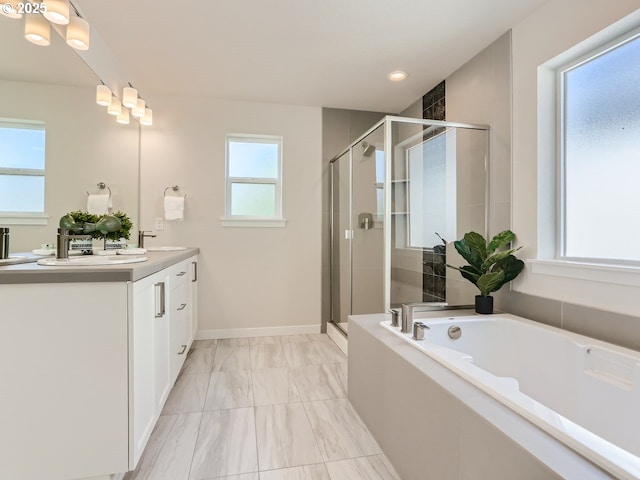 bathroom with independent shower and bath and vanity