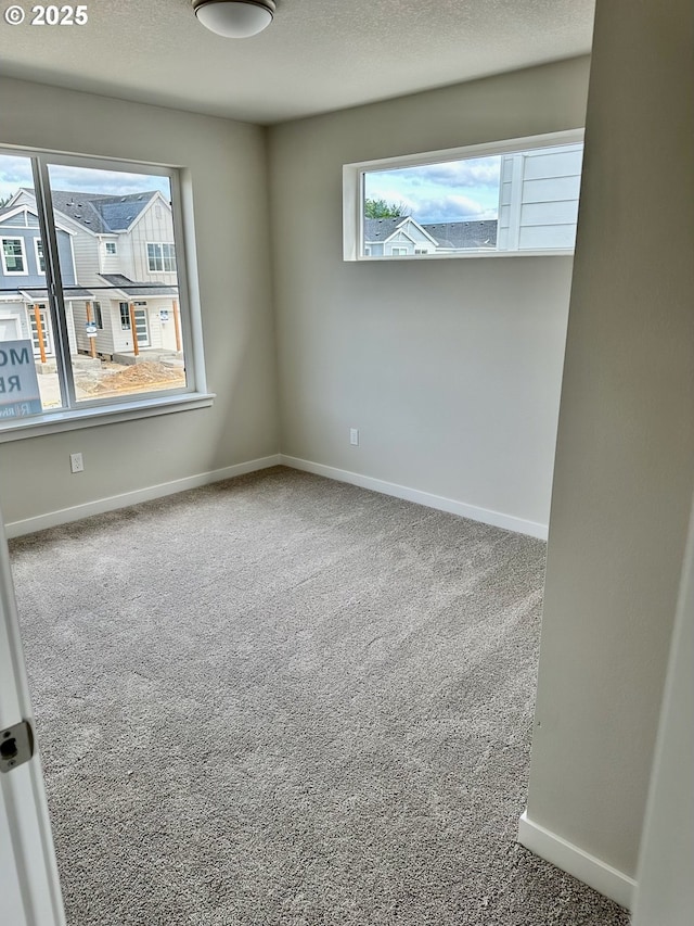 13847 SW Sabrina Ave, Tigard, OR 97140 - carpeted empty room featuring baseboards and a textured ceiling