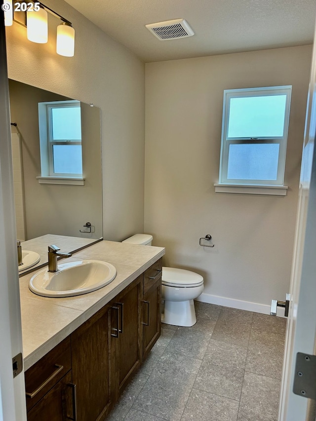 13847 SW Sabrina Ave, Tigard, OR 97140 - bathroom featuring vanity, toilet, baseboards, and a baseboard heating unit