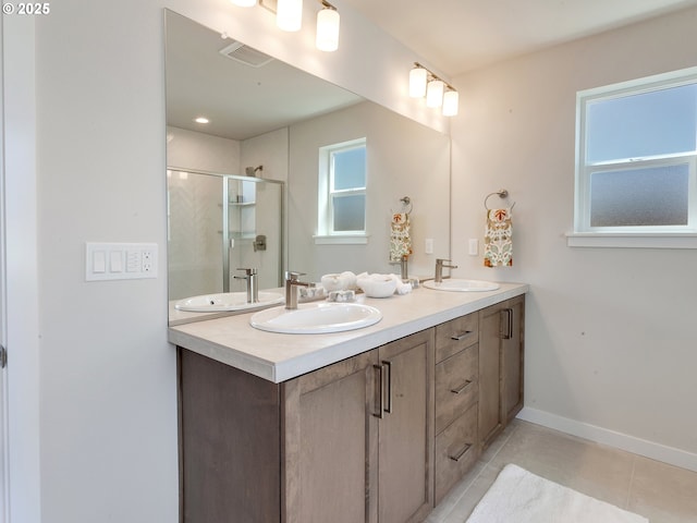 13847 SW Sabrina Ave, Tigard, OR 97140 - full bathroom featuring tile patterned floors, double vanity, and a stall shower
