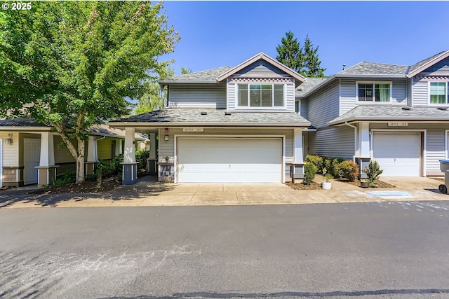 10793 SW Canterbury Ln Unit 101, Portland, OR 97224 - view of front of home with an attached garage and concrete driveway
